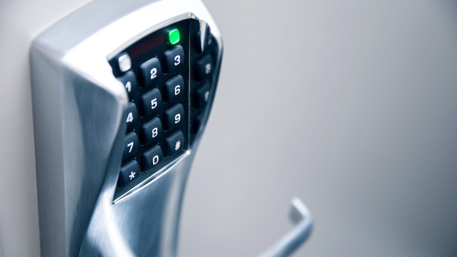 Commercial keypad door lock with lever handle for keyless entry at a Miami office